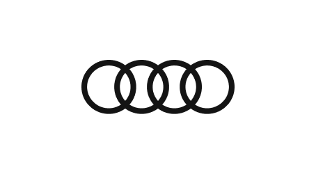 Symbole von vier ineinander verschlungenen Ringen, ein bekanntes automobillogobezogenes Design.