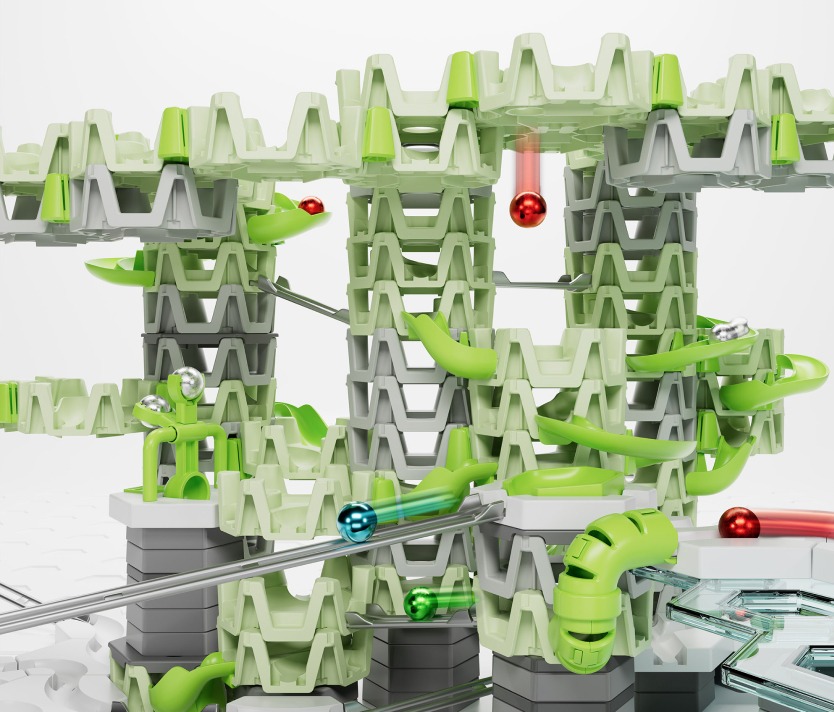 GraviTrax Murmelbahn mit grünen Schienen und Kugeln auf weißem Hintergrund, für kreative Konstruktionen und Spielspaß.
