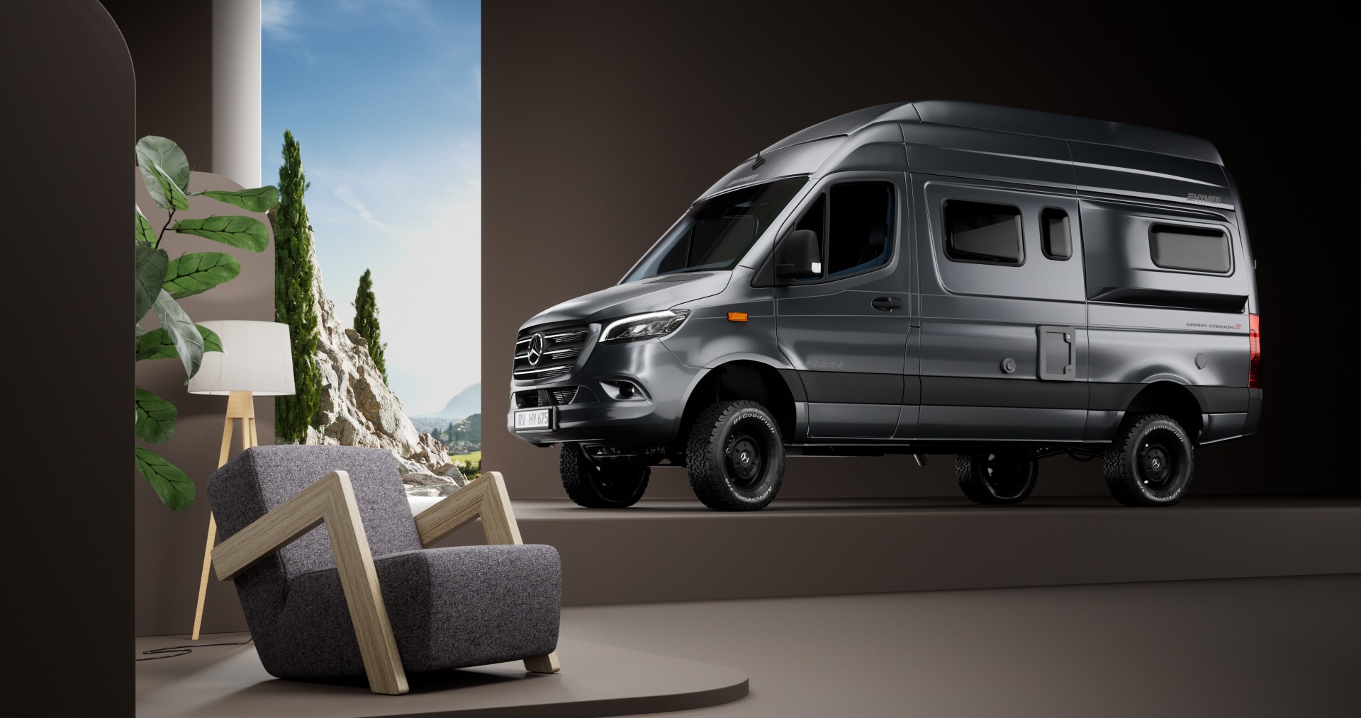 Moderner Campervan in stilvollem Innenraum mit Blick auf Berglandschaft und Pflanzen, graue Polstermöbel im Vordergrund.