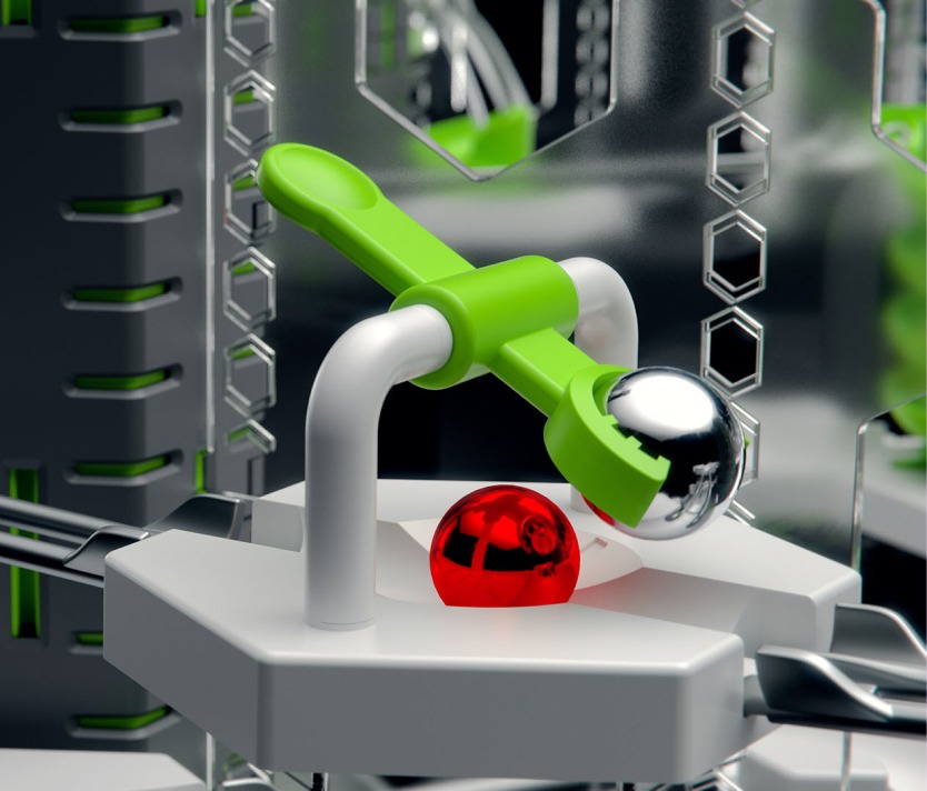 GraviTrax-Pro_h356-4col Grüne Hebelmechanik mit silberner Kugel auf futuristischem Brett in Hightech-Umgebung.