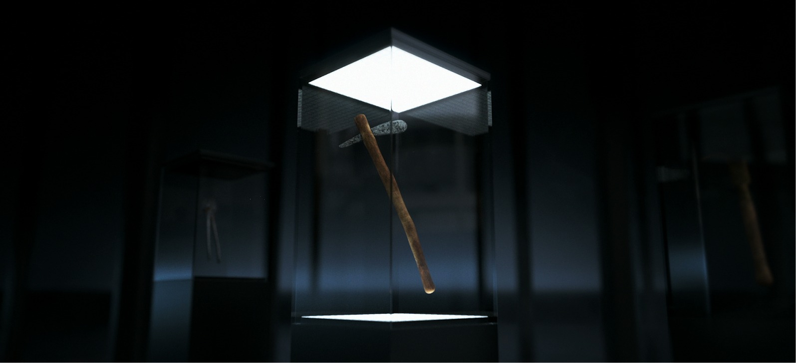 Altes Steinwerkzeug, präsentiert in beleuchtetem Glaskasten im Museum, dunkler Hintergrund.